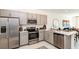 Well-equipped kitchen with stainless appliances, ample counter space, and open access to the living area at 16646 San Nicola Pl, Bradenton, FL 34211