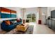 Stylish living room featuring contemporary decor, comfortable seating, and a view of the outdoors at 16646 San Nicola Pl, Bradenton, FL 34211