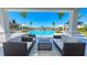 Inviting community pool area with cabana, comfortable seating, and lush landscaping for relaxing by the water at 16646 San Nicola Pl, Bradenton, FL 34211