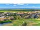Scenic aerial view of the community, showcasing its proximity to the ocean, lush greenery, and golf course at 1736 Suzi St, Punta Gorda, FL 33950