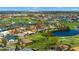 Expansive aerial shot showcasing a residential community with waterfront properties, golf courses and tropical landscaping at 1736 Suzi St, Punta Gorda, FL 33950