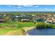 Scenic aerial view of the community, showcasing its proximity to the ocean, lush greenery, and golf course at 1736 Suzi St, Punta Gorda, FL 33950