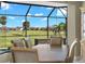 Cozy dining area featuring scenic views of the golf course and lush landscape at 1736 Suzi St, Punta Gorda, FL 33950