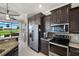 Bright kitchen features stainless steel appliances, granite counters and a breakfast nook overlooking the golf course at 1736 Suzi St, Punta Gorda, FL 33950