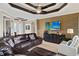 Cozy living room features a large TV, comfortable seating, and an open view to the foyer at 1736 Suzi St, Punta Gorda, FL 33950
