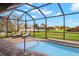 Backyard pool and patio with a spectacular golf course view at 1736 Suzi St, Punta Gorda, FL 33950