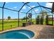 Relaxing screened-in patio with a view of the lush green golf course at 1736 Suzi St, Punta Gorda, FL 33950