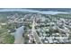 Aerial neighborhood real estate view showcases a home with pool, well-kept lawn at 1801 Forest Dr, Oldsmar, FL 34677