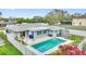 Enjoy the Florida sunshine in this home's backyard with a refreshing swimming pool and privacy fence at 1801 Forest Dr, Oldsmar, FL 34677