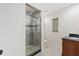 Updated bathroom featuring a glass-enclosed shower and modern fixtures at 1801 Forest Dr, Oldsmar, FL 34677