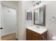 Bathroom featuring a vanity with a rectangular mirror and white countertop at 1801 Forest Dr, Oldsmar, FL 34677