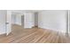 Bedroom with new flooring and adjacent rooms in view at 1801 Forest Dr, Oldsmar, FL 34677