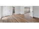 Bedroom featuring new flooring and a view of the adjacent bathroom at 1801 Forest Dr, Oldsmar, FL 34677