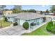 This home offers an attached garage, side yard, and well-maintained landscaping at 1801 Forest Dr, Oldsmar, FL 34677