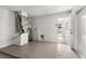 Unfinished garage featuring a water heater, air conditioning unit, and door to backyard at 1801 Forest Dr, Oldsmar, FL 34677