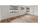 Bright living room with newly installed flooring and ample natural light at 1801 Forest Dr, Oldsmar, FL 34677
