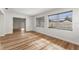 Bright living room featuring new flooring and plenty of natural light at 1801 Forest Dr, Oldsmar, FL 34677
