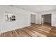Bright living room with newly installed flooring and open layout to kitchen at 1801 Forest Dr, Oldsmar, FL 34677