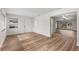 Open-concept living room featuring new flooring and plenty of natural light at 1801 Forest Dr, Oldsmar, FL 34677