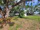The property features a sprawling backyard with mature trees, providing ample space for outdoor activities and relaxation at 1802 19Th W Ave, Bradenton, FL 34205