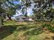 Expansive backyard with lush greenery, offering a serene outdoor space for relaxation and entertainment at 1802 19Th W Ave, Bradenton, FL 34205