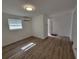 Bright bedroom featuring light, neutral walls and flooring with a bright, modern AC unit at 1802 19Th W Ave, Bradenton, FL 34205