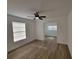 Light and airy bedroom with wood-look flooring, showcasing the home's open layout and design at 1802 19Th W Ave, Bradenton, FL 34205