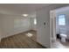 Bright bedroom with wood-look flooring and an attached bathroom, offering comfort and convenience at 1802 19Th W Ave, Bradenton, FL 34205