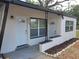 The exterior features dual entrances on a modern building with fresh paint and professional landscaping at 1802 19Th W Ave, Bradenton, FL 34205
