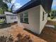 Rear exterior view of home showing a neutral paint color, with newly mulched areas around the perimeter at 1802 19Th W Ave, Bradenton, FL 34205