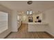 Modern kitchen with white cabinetry, stainless steel appliances, and an island with quartz countertops at 1802 19Th W Ave, Bradenton, FL 34205