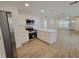 Modern kitchen featuring stainless steel appliances, quartz counters, and an open layout at 1802 19Th W Ave, Bradenton, FL 34205