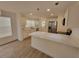 Bright and modern kitchen features white cabinets, quartz countertops, and stainless steel appliances at 1802 19Th W Ave, Bradenton, FL 34205