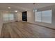 Spacious living room featuring modern fireplace and bright natural light from the front door and large windows at 1802 19Th W Ave, Bradenton, FL 34205