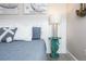 Charming bedroom with coastal decor, featuring a seahorse-shaped side table and nautical-themed artwork at 211 65Th St, Holmes Beach, FL 34217