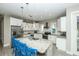 Bright kitchen with stainless appliances, island with seating, and recessed lighting at 211 65Th St, Holmes Beach, FL 34217
