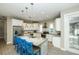 Bright kitchen with stainless appliances, island with seating, and recessed lighting at 211 65Th St, Holmes Beach, FL 34217