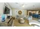 Open-concept living room flows into the kitchen, featuring stylish decor and comfortable seating arrangements at 211 65Th St, Holmes Beach, FL 34217