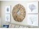 Stylish wall decor featuring driftwood mirror and tree artwork, adding a unique, coastal-inspired touch at 211 65Th St, Holmes Beach, FL 34217