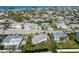 Aerial view of a neighborhood with homes and mature landscaping at 221 85Th St, Holmes Beach, FL 34217
