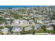 Coastal home in a dense neighborhood with lush landscaping and views of the Gulf of Mexico at 221 85Th St, Holmes Beach, FL 34217