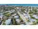 Aerial view of a neighborhood near a beach with homes and mature landscaping at 221 85Th St, Holmes Beach, FL 34217