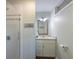 Bathroom featuring a walk-in shower, light vanity and mirror at 221 85Th St, Holmes Beach, FL 34217