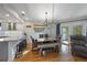 Bright dining area with hardwood floors, table and chairs, and direct access to the porch for relaxed dining at 221 85Th St, Holmes Beach, FL 34217