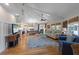 The home offers an open-concept layout with vaulted ceilings, hardwood floors, and comfortable seating arrangements at 221 85Th St, Holmes Beach, FL 34217