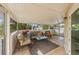 Cozy sunroom with plenty of natural light and comfortable seating at 221 85Th St, Holmes Beach, FL 34217
