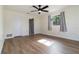 Bedroom with neutral tones and modern fixtures, including a ceiling fan and a window at 2477 Wood Oak Dr, Sarasota, FL 34232