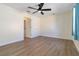 Bright bedroom with wood-look flooring, ceiling fan, and neutral walls ready for personalization at 2477 Wood Oak Dr, Sarasota, FL 34232