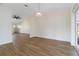 Bright dining room features neutral walls and light wood flooring, illuminated by pendant lighting at 2477 Wood Oak Dr, Sarasota, FL 34232
