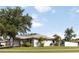 Charming single story home with landscaped front yard and well-maintained lawn at 2477 Wood Oak Dr, Sarasota, FL 34232
